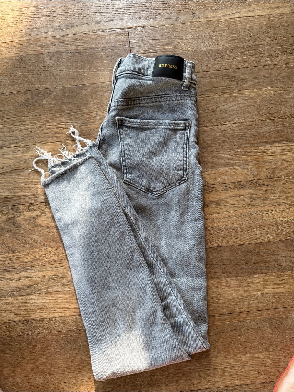 Express Light Gray Distressed Hem Skinny Jeans